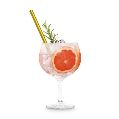 Un gin tonic rafraîchissant au pamplemousse, servi avec une paille en verre dorée HALM – le choix idéal pour des pailles en verre durables et réutilisables.