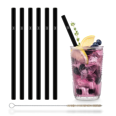 Wiederverwendbare schwarze HALM Glasstrohhalme in einem Glas Blueberry Spritz.