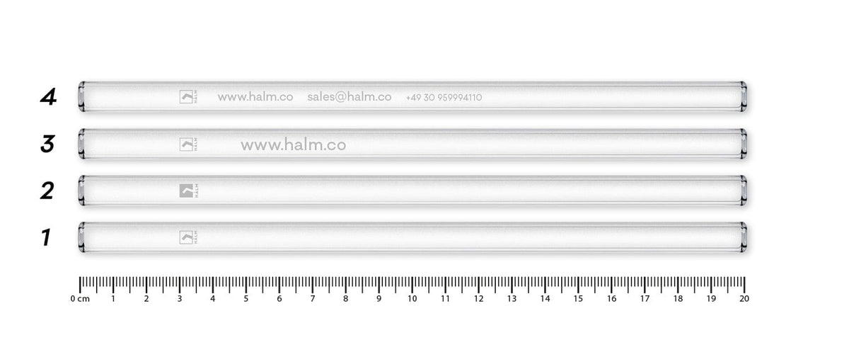 Four reusable HALM glass straws with various engraving examples as a digital sample photo.