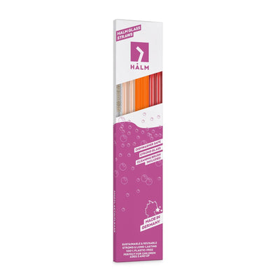 Wiederverwendbare HALM Glasstrohhalme in Pink, Orange und Mattrot in der 30 cm Slim Edition schräg in der Verpackung präsentiert